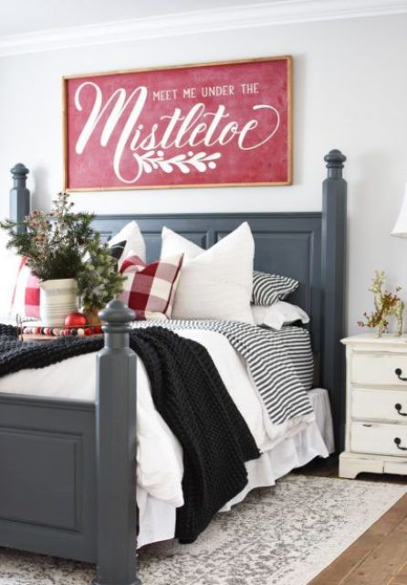 a red Christmas sign ina  stained frame and with white letters is a sylish vintage decor idea to try