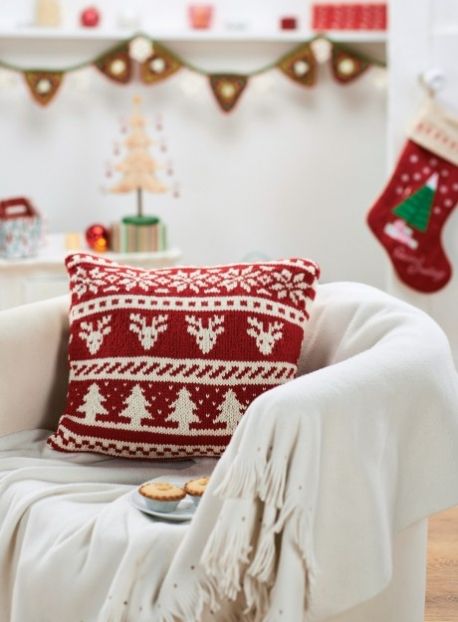 a red and white Scandinavian pattern pillow like this one is a cool idea for holiday decor, and you can buy or make it yourself