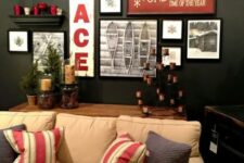 a stylish holiday gallery wall with photos, signs and candles on the shelves is a bold idea