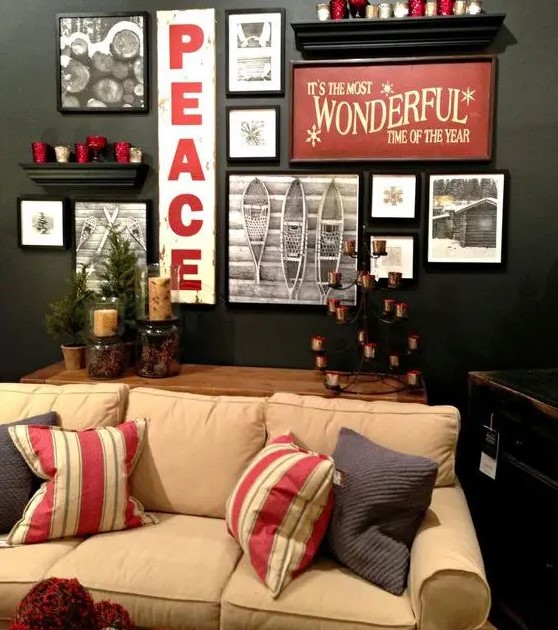 a stylish holiday gallery wall with photos, signs and candles on the shelves is a bold idea