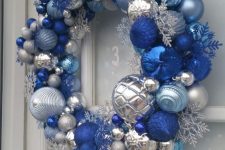 a super bold Christmas wreath in silver, light and bold blue, with snowflakes and beads is a lovely and bright idea