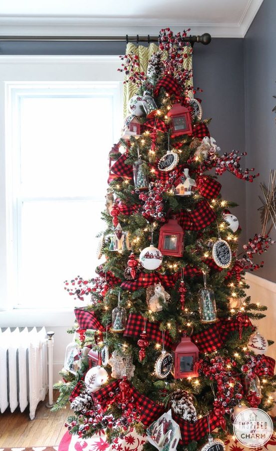 a super bright Christmas tree with lights, chalkboard and red lantern ornaments, bells, trees and berries plus plaid ribbons