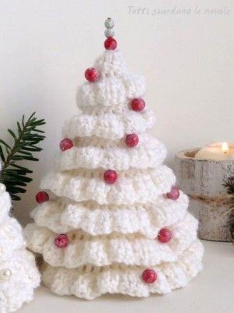 a white knit Christmas tree with red beads is a lovely tabletop decoration is a lovely idea for holidays