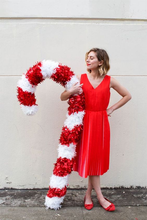 an oversized candy cane can be used as a decoration for indoors or outdoors and is amazing and bold