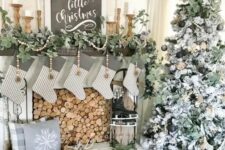 beautiful and cozy neutral rustic Christmas decor with wooden beads, greenery garlands, a black and white Christmas sign, skates and striped stockings
