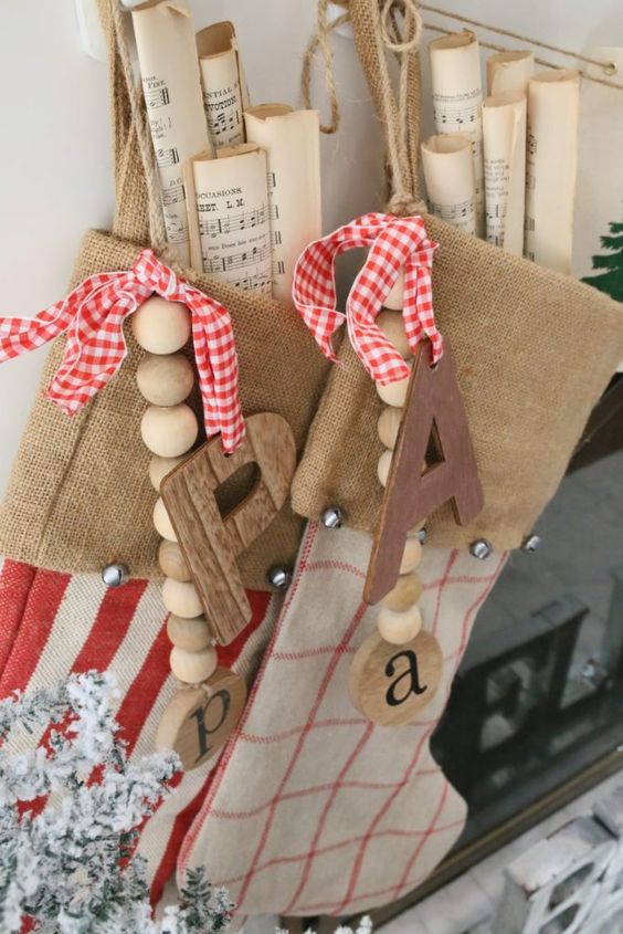 burlap stockings with wooden beads and monograms, plaid bows and vintage note paper are amazing for vintage Christmas spaces