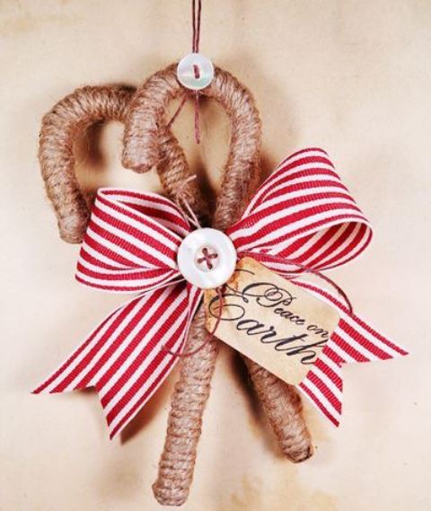 classy rustic Christmas ornaments - candy canes wrapped with twine, with buttons and a striped bow are amazing