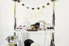 colorful fringe and black, gold and white balloons around will make any space party-like