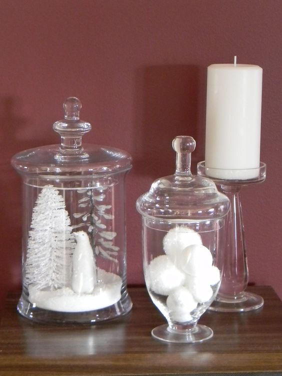 glass jars with faux snow, a tinsel tree, a polar bear and some snowballs compose a lovely winter arrangement for Christmas