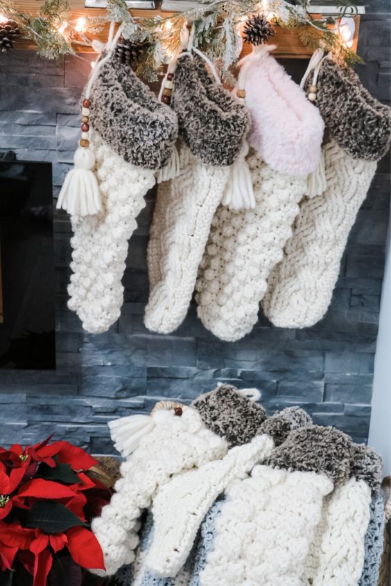 gorgeous oversized white knit stockings with faux fur and beads and tassels are great to bring Christmas spirit to your home