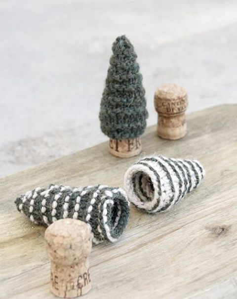 grey and white knit mini Christmas trees like these ones can be put on corks to make little and cute holiday decor