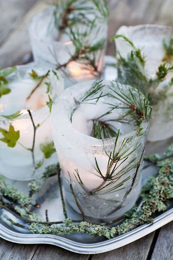ice luminaries with evergreens and leaves are amazing for holiday and Christmas decor, they will add a rustic feel