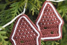 pretty knit gingerbread house ornaments with white rims are great Christmas ornaments or gift tags