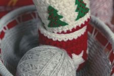 red, white and green mug cozies with beads and felt Christmas tree appliques are amazing decor you can knit yourself and they can act as gifts, too