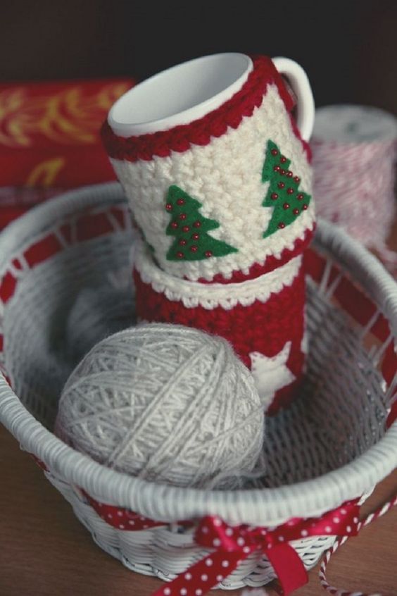 red, white and green mug cozies with beads and felt Christmas tree appliques are amazing decor you can knit yourself and they can act as gifts, too