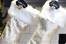 silver sequin Christmas stockings with white faux fur, black chalkboard tags and gold bows are amazing for glam Christmas decor