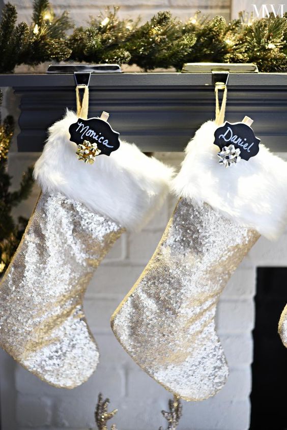 silver sequin Christmas stockings with white faux fur, black chalkboard tags and gold bows are amazing for glam Christmas decor