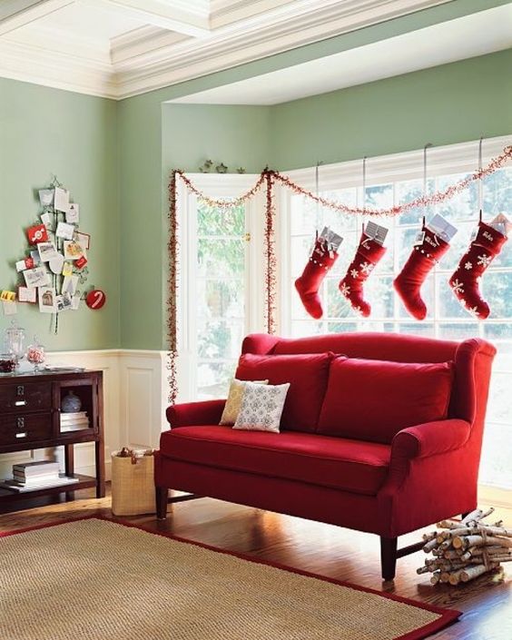 traditional red and white Christmas stockings hanging over the window is a creative way to style your space for Christmas