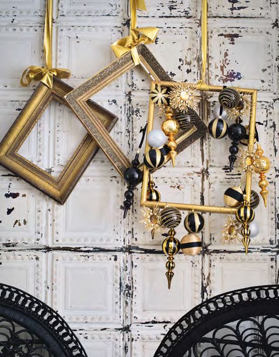 vintage gilded frames including one with gold and black ornaments hanging for lovely Christmas decor and a bold touch