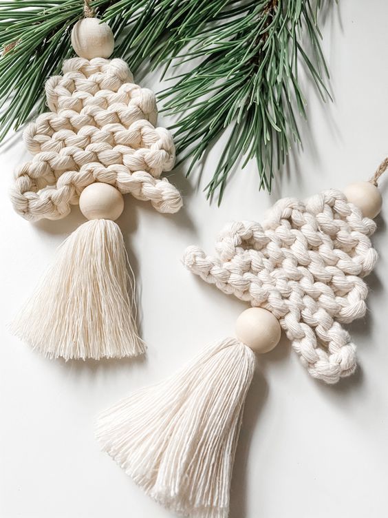 white knit Christmas ornaments with oversized wooden beads and tassels are amazing Christmas ornaments you can make yourself
