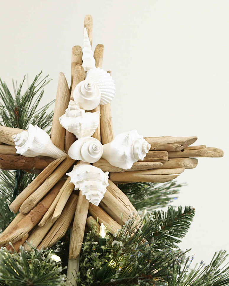 a driftwood and seashell star tree topper is amazing for a beach or coastal Christmas tree and looks cool