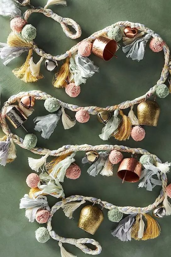 a gorgeous garland of pastel pompoms, vintage and usual bells and tassels for a Christmas tree or some space