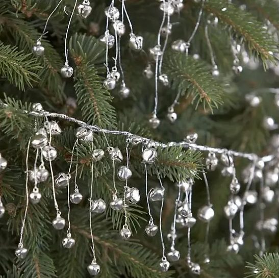 garlands of tiny silver bells are amazing to decorate your Christmas tree and you can also hang them somewhere else, too