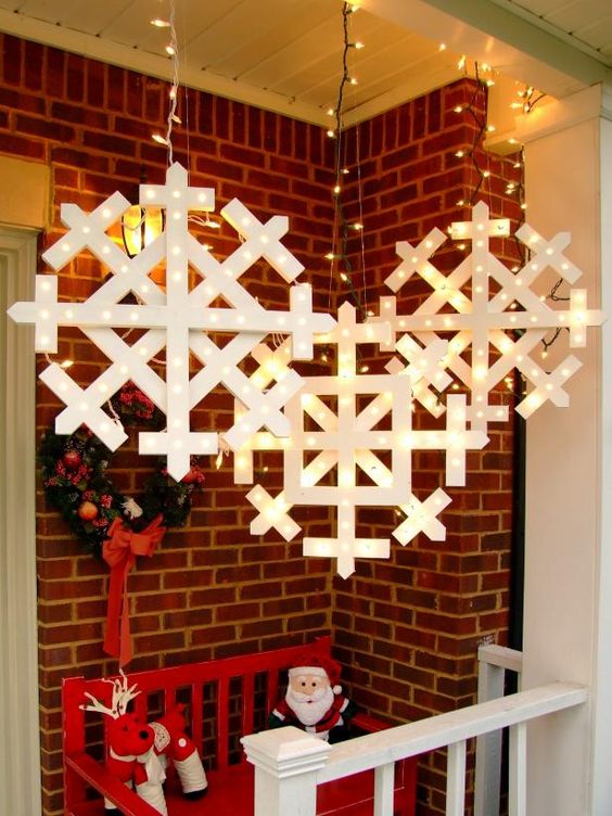 marquee snowflakes hanging over the porch or in your garden will bring a strong festive feel to the space and will make it Christmassy