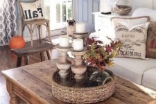 a rustic wooden coffee table with woven baskets for storing smaller things