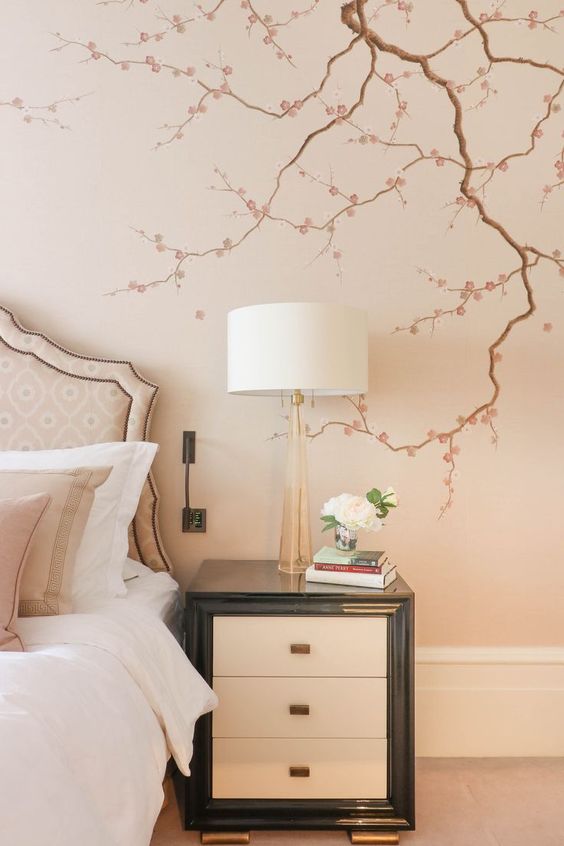 cherry blossom decals on the wall of your bedroom will make the space feel like spring and romance