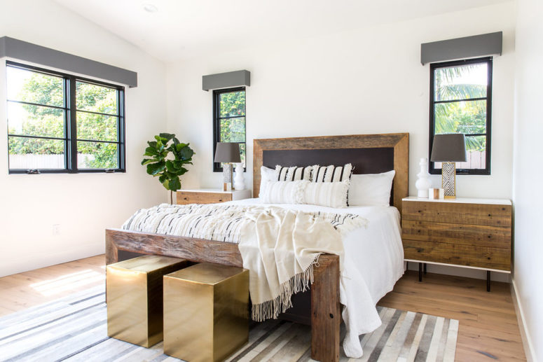 a contemporary famrhouse with neutral walls and ceilings, weathered wood furniture and polished gold stools  (Lindye Galloway Interiors)