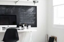 a Nordic home office mostly in white, with a chalkboard statement that can be used as a memo board