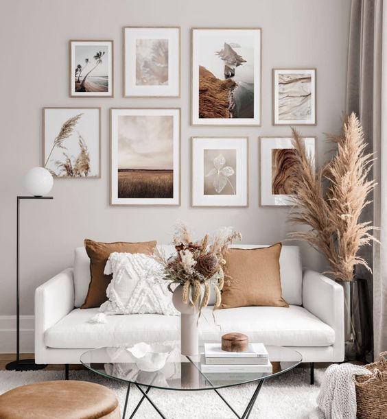 a beautiful nature-inspired gallery wall in light stained frames is a lovely decor idea to rock