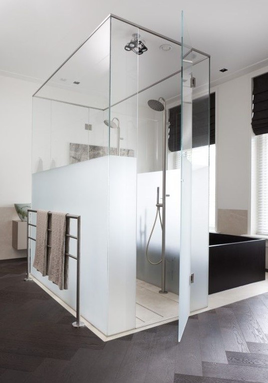 a shower space of partly usual and partly frosted glass is ideal to separate it from the rest of the bathroom