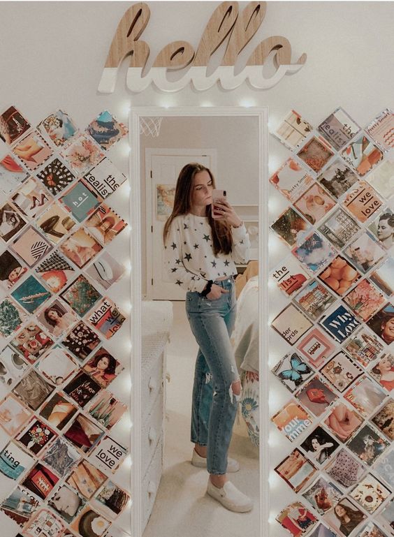 a tall mirror and color photos from Instagram attached to the wall on both sides of it is a lovely and fun decor idea