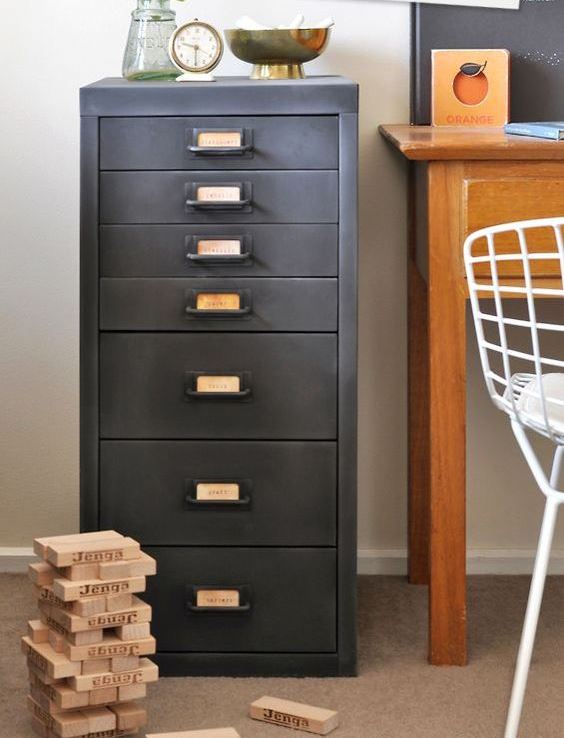 a vintage filing cabinet refinished with chalkboard paint that gives it a worn and very refined vintage feel