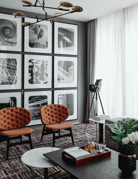 an elegant black and white gallery wall with pics in black frames is a stylish decor idea for any space