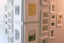 cover an awkward corner with a gallery wall with photos in matching white frames to make the use of it