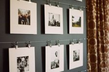 metal rails attached to the wall allow you attaching as many pics as you want and change them anytime