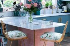 a lovely blue kitchen design with lots of floral prints