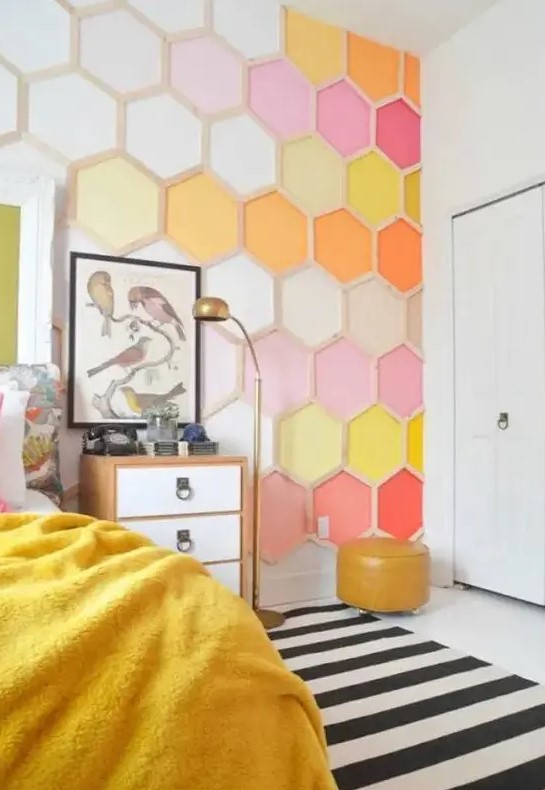 a bold bedroom done with a colorful honeycomb accent wall is a bright and cool idea to rock, it will add both color and pattern