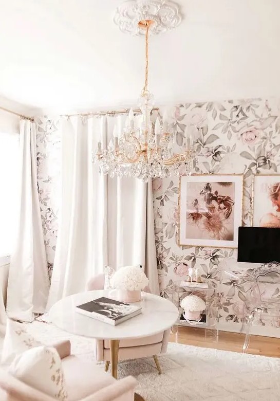 a neutral living room with floral wallpaper, neutral seating furniture, neutral curtaons and clear Lucite furniture