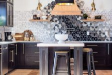 a stylish black shaker style cabinets, a catchy geo tile backsplash, black pendant lamps and stools and touches of gold