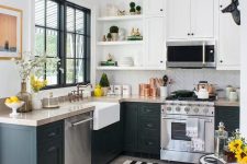 a stylish modern farmhouse kitchen with black and white cabinets, a chevron backplash and a black and white striped rug