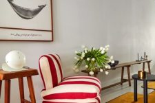 a super bold and catchy red and white striped chair will accent your space both with color and print