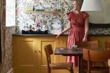 a cozy kitchen with yellow cabinets