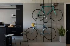 metal slabs are great to hold your bikes and they look stylish and cool and integrate them into the interior in a lovely way