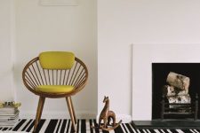 this statement black and white rug takes over the whole space and makes it look bolder, catchier and unique thanks to the irregular stripes