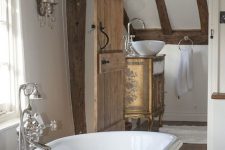 a cozy bathroom with wooden beams