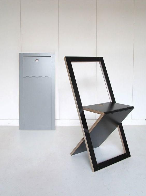 a black minimalist folding chair is a cool idea for any small modern space